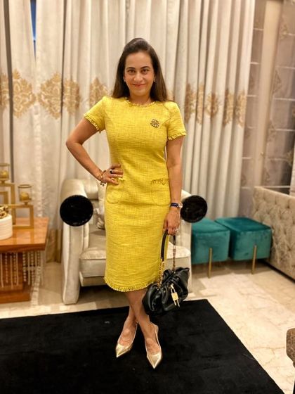 A sneak peek of a new piece from my clothing line. This yellow tweed dress is perfect for transitioning between seasons, and I've styled it here with a black bag and gold heels for a classic look.