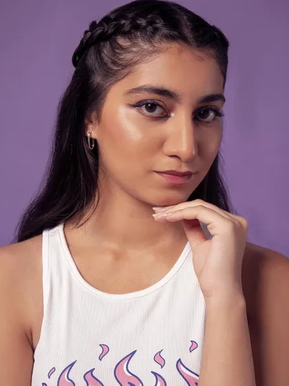 A classic beauty pose, highlighting the model's features and the clean makeup.