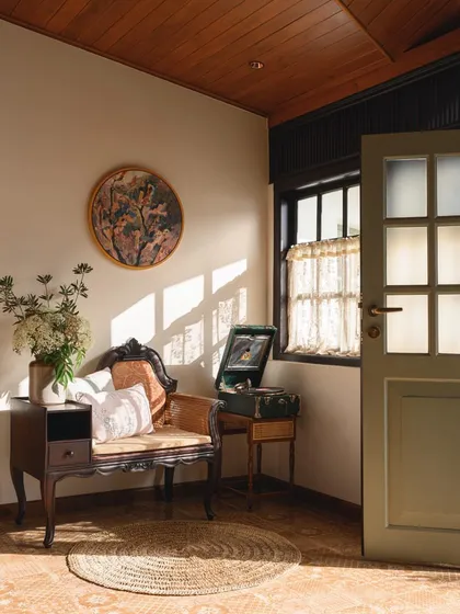 A quiet corner in the Mount Pleasant Villa in Coonoor, where colonial-era furniture and a vintage record player evoke a sense of nostalgia and heritage.