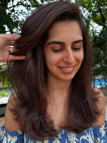 Sometimes all you need is a color refresh and a good haircut. I touched up her roots, toned her existing highlights, and gave her a fresh layered cut to bring her hair back to life.