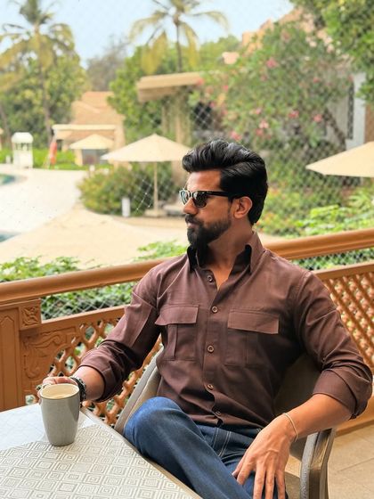This image captures the essence of a relaxed vacation, with our client looking comfortable and chic in our brown shirt.