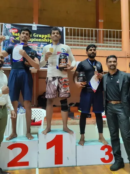 Standing on the number one spot of the podium at the Open National Grappling Championship. Hard work in the gym pays off on competition day.