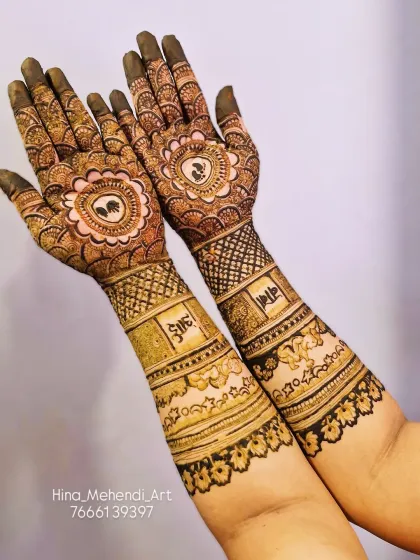 This baby shower mehendi includes the words 'aai' and 'baba' (mom and dad) in Marathi. The palms feature baby feet inside a floral mandala.