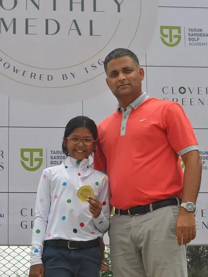 A coach with a female gold medalist. We are committed to developing champions in both the boys' and girls' categories.