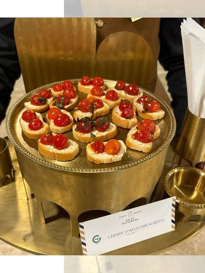 Classic Cherry Tomato Bruschetta served on a beautiful brass tray. The freshness of the tomatoes and basil makes this a timeless and elegant appetizer.