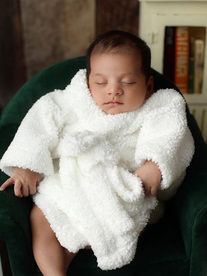 The ultimate relaxation. This baby is enjoying a spa day, showcasing a fun and imaginative theme that we can create in the studio.