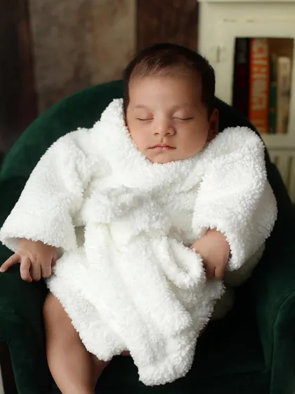 The ultimate relaxation. This baby is enjoying a spa day, showcasing a fun and imaginative theme that we can create in the studio.