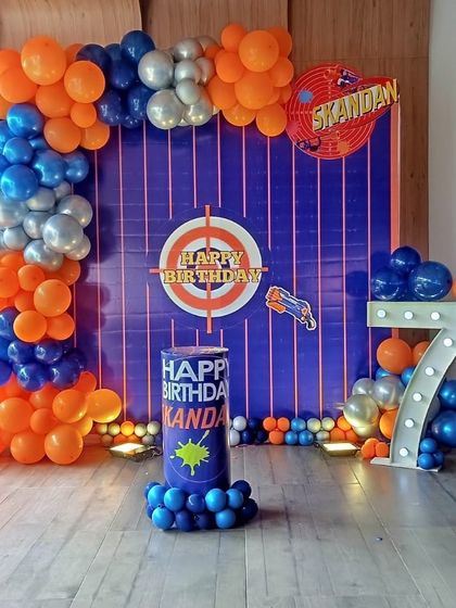 It's Nerf or nothing! A fun Nerf gun target theme in orange and blue for a 7th birthday party.