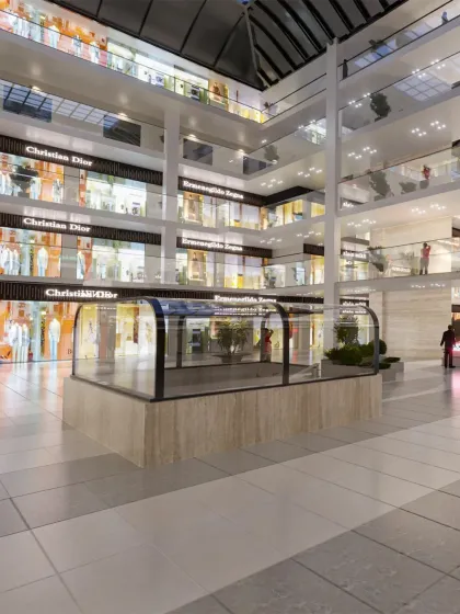 The open atrium design allows natural light to filter down through the levels, creating a bright and welcoming shopping environment.