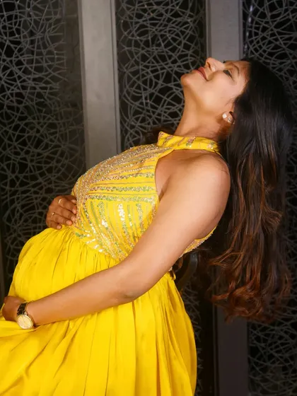 We also offer non-maternity gowns for pre-wedding shoots and other events. This hand-embroidered yellow satin gown is a vibrant and flowy option for any celebration.
