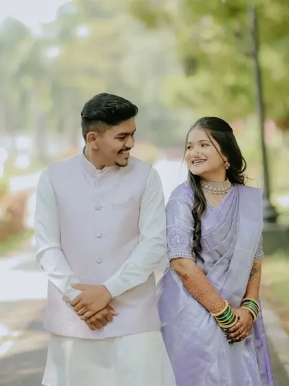 A candid moment between the engaged couple. The bride's mehndi is a beautiful detail in this happy memory.