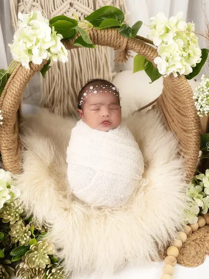 A slightly different angle of the boho basket setup, showing the beautiful textures of the jute, fur, and flowers that create this organic and earthy portrait.