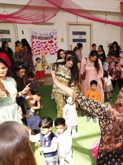 A candid moment of pure joy and movement. Our events are designed to get everyone, from toddlers to adults, dancing and celebrating together.
