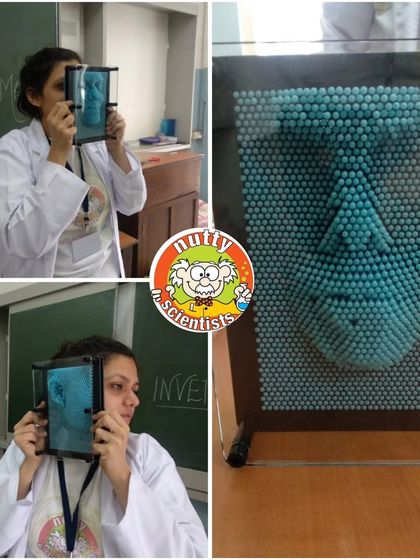 A professor demonstrates our giant impression board, a tool that lets kids explore the science of shapes and pressure by making 3D imprints of their faces and hands.