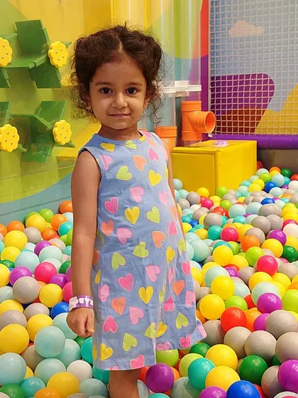 Dressed in her best and ready to play! Our ball pit is fun for any occasion.
