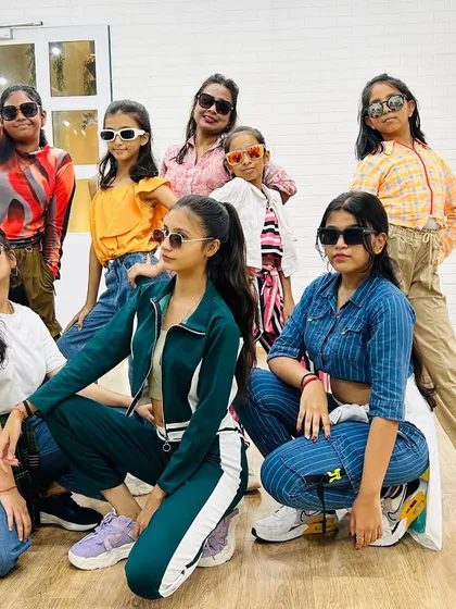 Our teen and adult students posing with attitude. We help you build confidence that you can carry both on and off the dance floor.