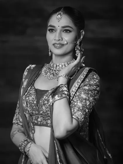 I provide both color and black and white versions of your images. This monochrome portrait of a bride emphasizes emotion and the fine details of the jewelry and outfit, offering a classic, artistic alternative for your portfolio.
