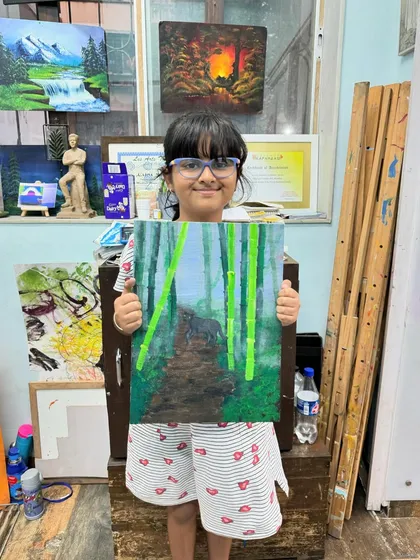 Even my younger students can master advanced techniques. This little artist did a fantastic job creating a sense of depth in her blurry forest painting.
