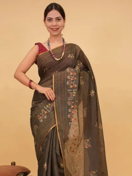 An earthy-toned 1-minute saree with delicate floral embroidery on the pallu. This piece is perfect for those who appreciate subtle details and a more understated ethnic style.