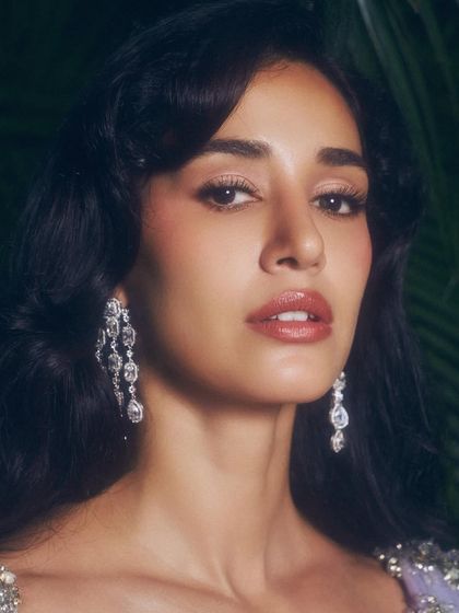 A beauty shot focusing on the makeup for this ethnic look. I used warm, rosy tones on the eyes and lips to create a fresh and radiant appearance.