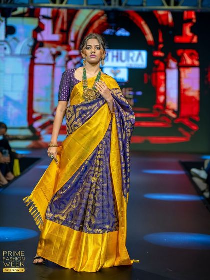 A royal combination of deep blue and bright yellow brocade Kanchipuram silk, a saree fit for a queen.