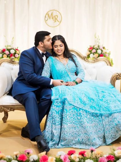 A sweet kiss on the cheek, a classic and timeless portrait from an engagement ceremony.