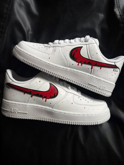 A pair shot of the red drip custom sneakers, with "KILL" and "BILL" text details.