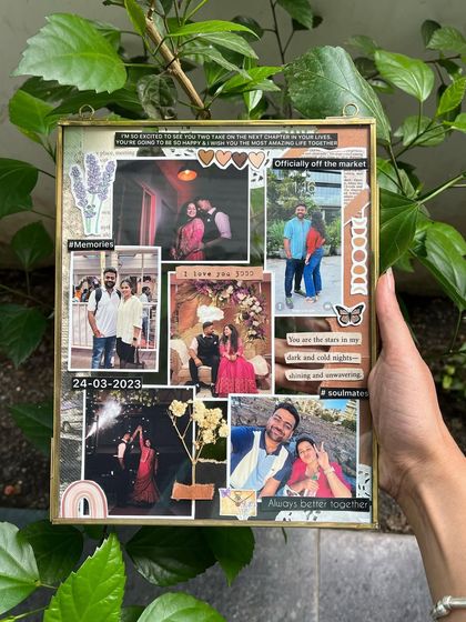 A closer look at a custom vintage glass frame, held up against some greenery. I love how the natural light shines through, highlighting the photos and delicate details inside.