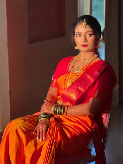 A regal portrait of the bride, her pose exuding confidence and grace.