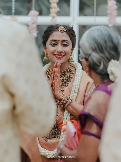 The bride seeks blessings from an elder, a moment of respect and tradition.