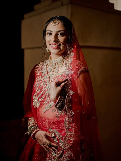 Another beautiful portrait of the bride, her happiness radiating through. The soft glam makeup enhances her features without overpowering her natural beauty.