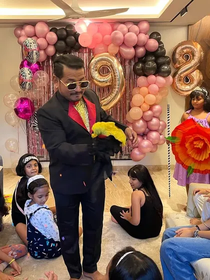Even with my cool shades on, I can see the smiles and curiosity on the kids' faces. Performing in a relaxed home setting allows me to connect with every single child.