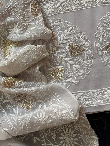 A close-up of the dupatta, showing the delicate beadwork and embroidery.