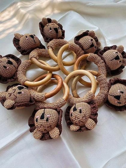 Here is a collection of my lion rattles, made with baby-safe yarn and natural wood rings. These are a great example of a bulk order I did for eco-friendly and vegan baby toys.