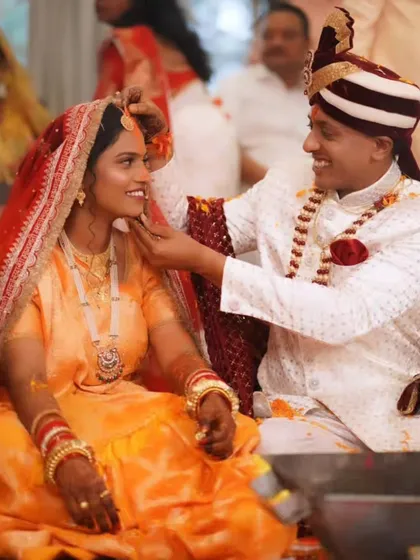A tender moment between the groom and bride during the wedding ceremony.