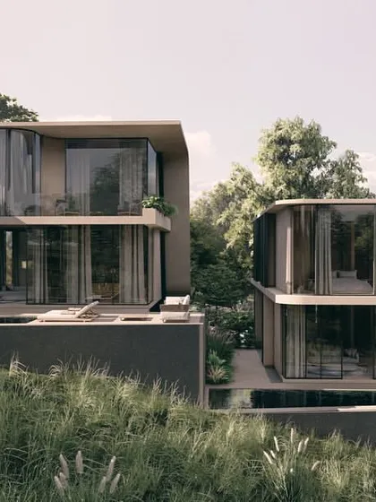 This view shows how the Moira villas are staggered on the slope, each with its own pool deck and view. The design ensures that every residence maintains a strong connection to the landscape and a sense of privacy.