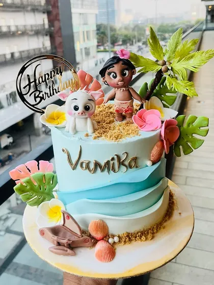 I brought the magic of Motunui to life with this Moana-themed birthday cake. It features hand-sculpted fondant figures of Moana and Pua on a sandy beach, complete with buttercream waves and tropical flowers, perfect for a Disney-themed party.