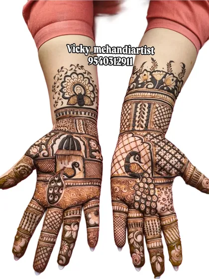 I love creating these fully detailed traditional mehandi designs. This piece features classic peacock and architectural motifs, perfect for a wedding guest who wants an elaborate look.