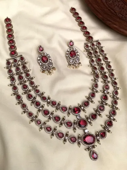 A ruby-red version of the three-layered antique necklace.