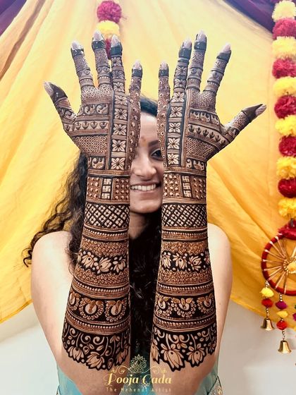 That smile says it all! My NRI bride from the US was thrilled with her bridal mehendi, which featured her favorite peacock motifs and intricate patterns.