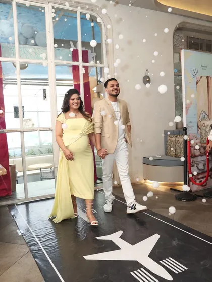 Making a grand entrance on an airplane runway. This unique detail for our travel-themed baby shower made the parents-to-be feel like stars as they walked in amidst bubbles.