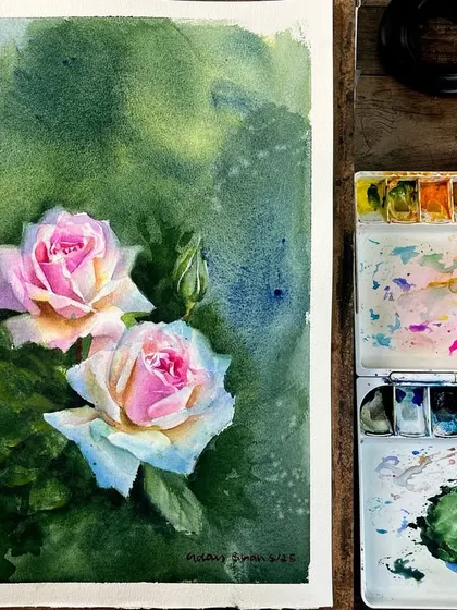 A view of the rose painting on my desk, showing the work alongside my palette and brushes. This gives a glimpse into my teaching setup for online workshops.