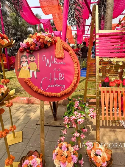A personalized welcome sign for the Haldi ceremony, framed by marigold garlands and floral arrangements. It's these little touches that make guests feel truly welcomed into the celebration.