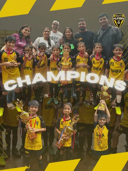 The entire U8 squad celebrating their championship win with coaches and parents. Victories are a team effort, and our SMFA family celebrates together.