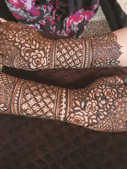 A close-up look at a heavy bridal design, packed with detail. I focused on creating layers of texture here, using intricate netting, bold rose motifs, and delicate shading to cover the hands and arms completely.