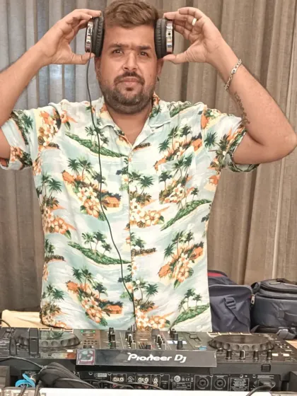Taking a moment to connect with the music before dropping the next beat. The headphones are essential for lining up the perfect mix.