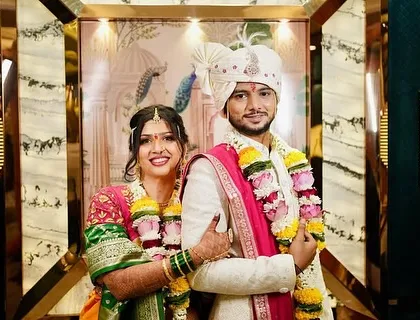 Another beautiful portrait of the couple, showcasing the bride's flawless makeup and the groom's sharp look.