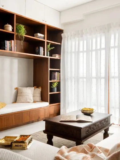 A close-up of the family area's reading nook and seating. The design combines ample storage for books with comfortable seating, tailored to the family's lifestyle.
