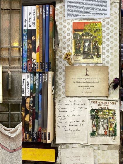 A detail from a bookshop in Khan Market, with handwritten notes and postcards tucked among the books.