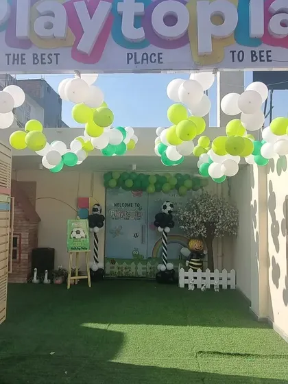 Our entrance decorated for a football-themed party. The green turf and balloon goalpost set the stage for a sporty celebration.